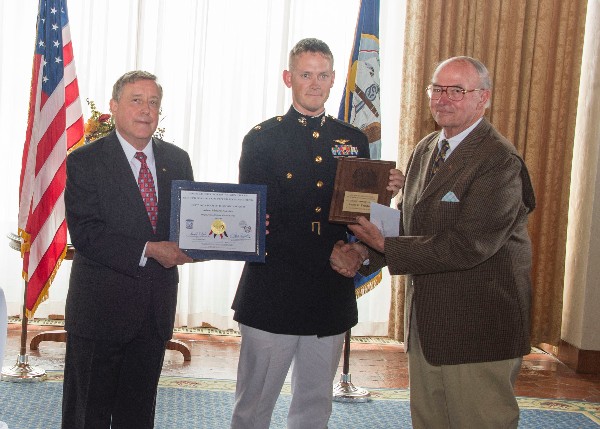 AFCEA 131st Wozencraft E&CE Award recipient Maj. Foushee (c), USMC, receives congratulations from Naval Postgraduate School President Vice Adm. Ronald Route, USN (Ret.), and Chapter President Lawrence Reeves.