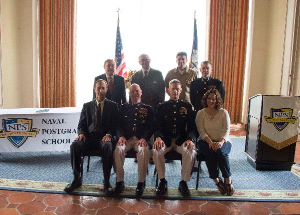 AFCEA Wozencraft award recipients join Naval Postgraduate School (NPS) leadership for a photo. Front row (l-r): Dr. James Newman, acting NPS provost; Col. Mitch McCarthy, USMC, associate dean of research; award recipient Maj. Adam Foushee, USMC; Annemarie Larsen; back row: Vice Adm. Ronald Route, USN (Ret.), NPS president; Chapter President Lawrence Reeves; Lt. Cmdr. Peter Harley, USN, electrical engineering and mathematics program officer; and joint C4I awardee Maj. Eric Larsen, USMC.