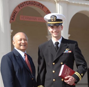 Dr. Thomas Kailath (l) presents Lt. Nathan Geisinger, USN, a student at the Naval Postgraduate School (NPS), with the AFCEA Winter Quarter 2010 Honor award at the March pre-graduation ceremony. He also received a volume of the Principles of Communication Engineering, co-written by the late Jack Wozencraft, a communications pioneer and former NPS professor.