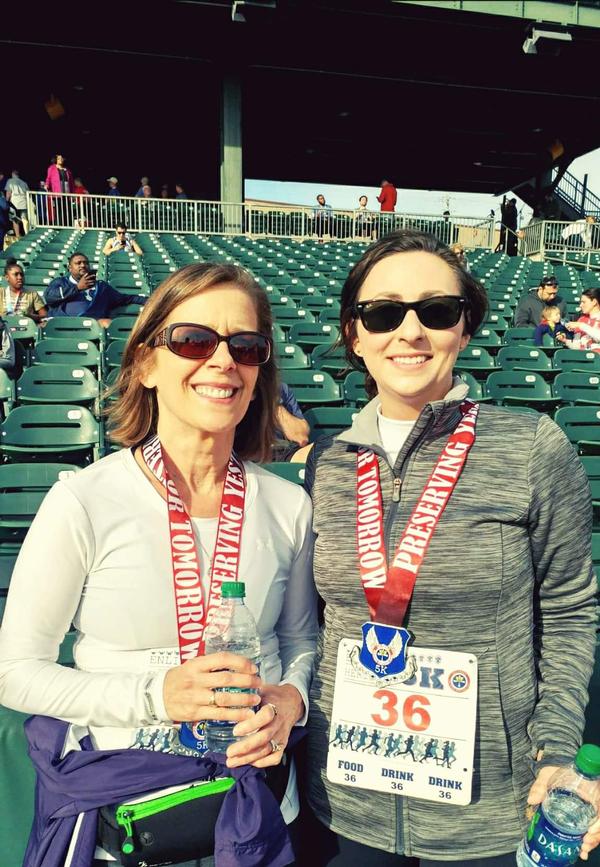 Two members of the chapter's Young AFCEAN "Get Fit" team meet at the finish line of the Enlisted Heritage Hall 5K and Montgomery Half Marathon in March.
