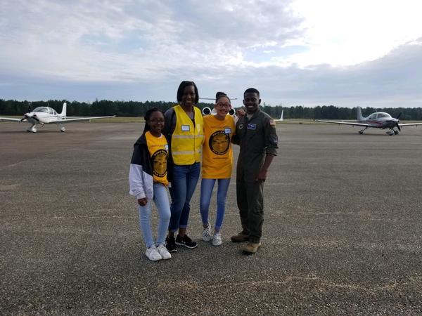 Col. Kyna McCall, USAF, chapter president (c), poses with participants and pilot during the March Eyes Above the Horizon Event. 
