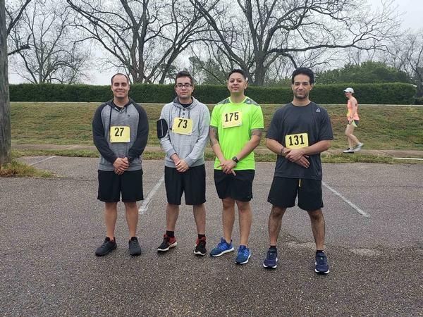 The Young AFCEAN Advisory Council 5K team poses before the April race. Pictured (l-r) are Senior Airman Tony Cruz, Senior Airman Juan Hoyos-Vallinas, Technical Sgt. Cedrick Williams and Adam Rose. 