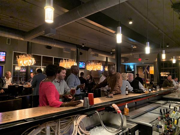 Members network at Alley Bar during the annual membership mixer in October. 