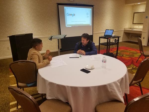A workshop attendee engages in a one-on-one session with a resume counselor at the February event.