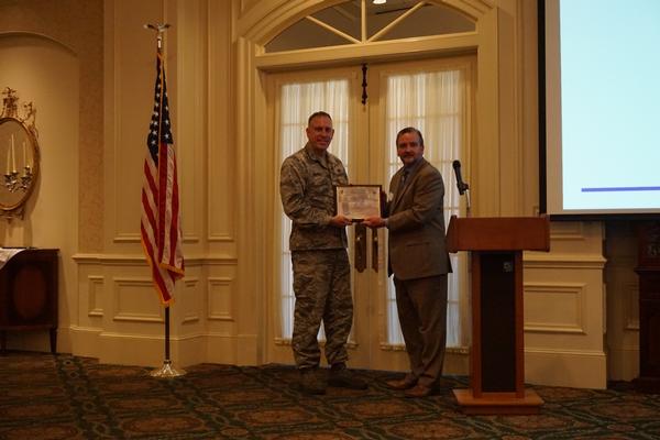 Chapter President Brian Knott (r) presents Col. Kyle Reybitz, USAF, deputy program executive officer (PEO) for Business and Enterprise Systems (BES), with a token of appreciation for speaking at the chapter's January meeting.