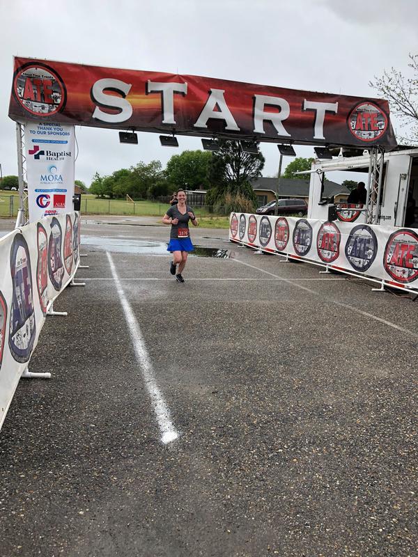 Master Sgt. Brandy Silvers, USAF, crosses the finish line at the Centerpoint Half Marathon and 5K in April. The chapter's Young AFCEANs participated in the event supporting local and international causes.