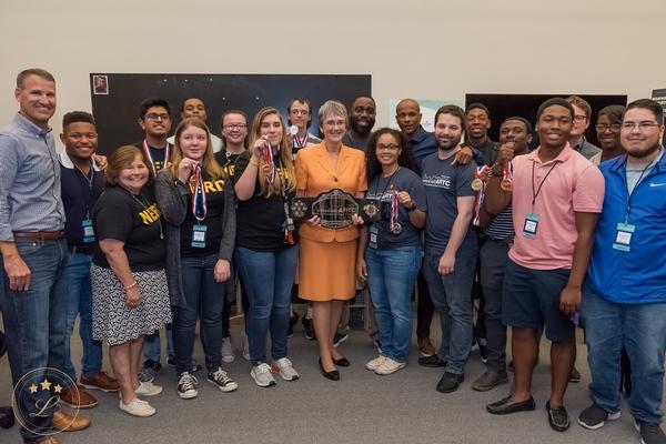 InnovateAFITC winners and staff members display the grand prize and event challenge medals from the August cyber and STEM competition, co-sponsored by the chapter.