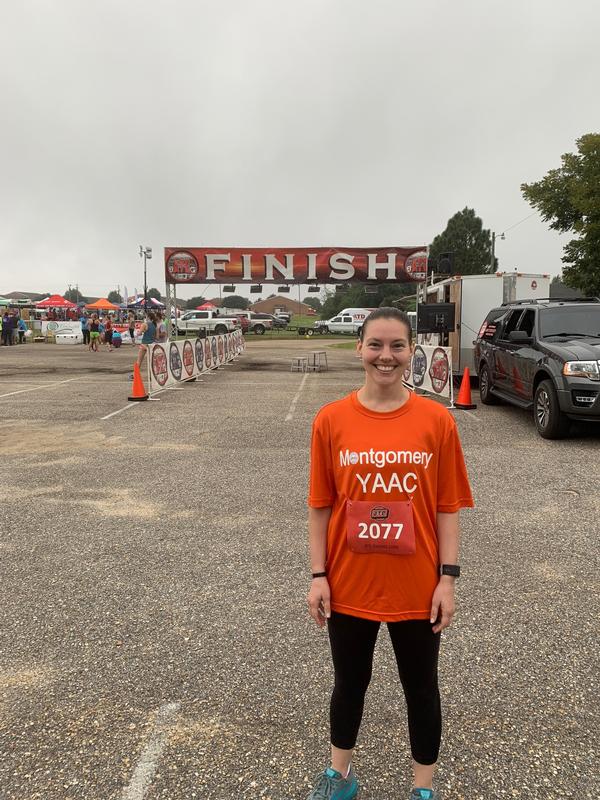 Master Sgt. Brandy Silvers, USAF, celebrates at the finish line of the October Nitty Gritty 5K, a race supporting the Prattville, Alabama, YMCA.