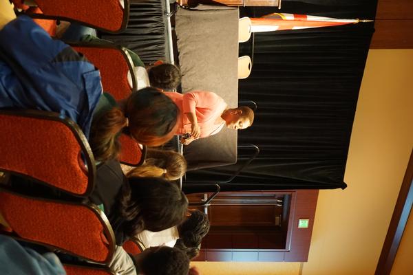 Essye Miller (front, c) helps high school girls form career goals at the August Women in STEM Mentoring Session.