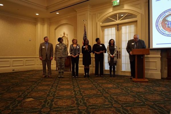 AFCEA Mid-South Regional Vice President Tom Gwaltney installs officers at the chapter's January meeting. They include (l-r) Knott, president; Col. Kyna McCall, USAF, vice president; Candace Akerson, secretary; Charisse Stokes, director, Education Foundation; Cheryl Brown, treasurer; and Tija Brown, Young AFCEA Advisory Council president. 