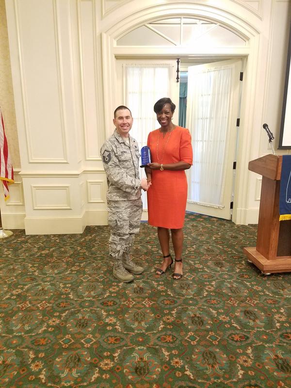Col. McCall presents Master Sgt. Jason Silvers, USAF, Barnes Center, with the chapter Government AFCEAN of the Year award at the September meeting.