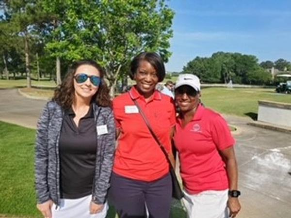 Chapter members and participants pose for a photo. In May, the chapter raised over $130,000 through corporate sponsorships.