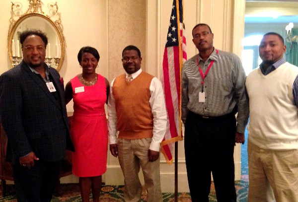 Charisse Stokes (2 from l), director of the chapter's Education Foundation, welcomes Dr. Melvin Lowe (far l) and Macon County Career Tech instructors Christopher Clark (c), William Turner (2 from r) and Tracy Stacy to the October meeting.