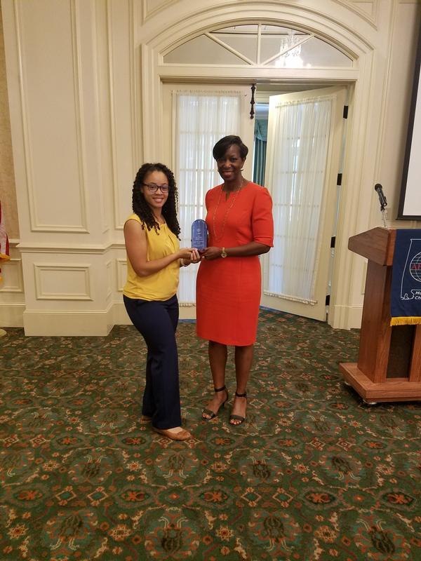 In September, McCall presents Jacqueline McKinney, TRUSS, with the Chapter Young AFCEAN of the Year.