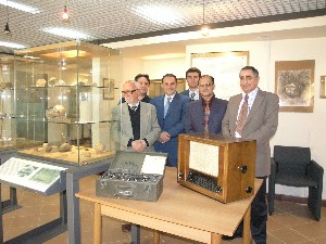 Professor Italo Biddittu (l), the paleontologist who unearthed a hominid skullcap that dates back almost 900,000 years, welcomes chapter members to the Prehistoric Museum of Pofi in May.