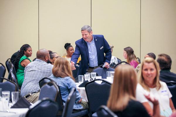 Marv Gordner, chapter president, welcomes the educators to the August event.