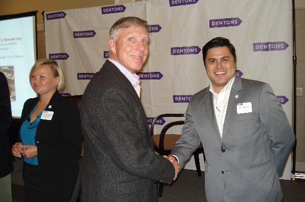 At the conclusion of the chapter's June program, Lt. Gen. Mark Bowman, director, command, control, communications and computers (C-4)/cyber, chief information officer, Joint Staff, J-6, the Pentagon (l), congratulates Jason Becerra on becoming the Northern California Regional Young AFCEAN for Industry by pinning on Becerra's Regional Young AFCEAN pin. 