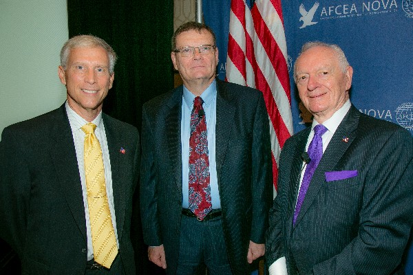 Chapter President David Scarbalis (l) and Past President Chuck Corjay (r) welcome speaker Terry Halvorsen, Defense Department chief information officer, to the chapter's Joint Warfighter IT Day in September.