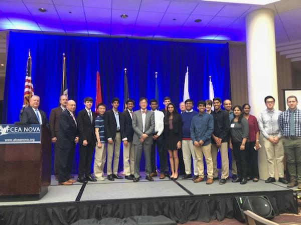Gary Wang, the U.S. Army's deputy chief information officer/G-6 (c), gathers with chapter leaders and science fair award winners for a group photo at the May luncheon.