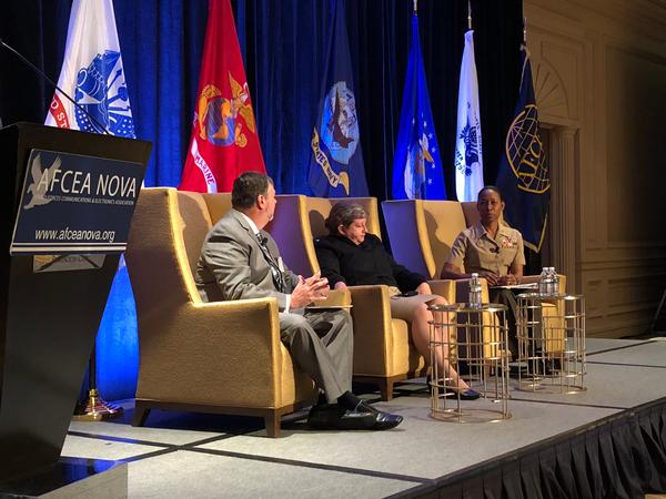 Chris Smith, AT&T, moderates a fireside chat during the chapter's Naval IT Day in October with Rear Adm. Danelle Barrett, USN, cybersecurity division director, N2/N6 (c), and Brig. Gen. Lorna Mahlock, USMC, director, command, control, communications and computers, Headquarters Marine Corps.