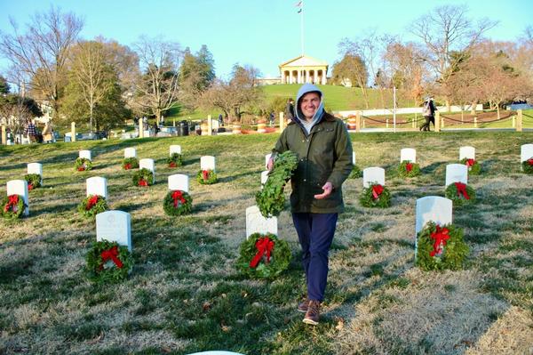 Liam Walsh, chapter events chair, Emerging Leaders, lays wreaths at Arlington National Cemetery in December.