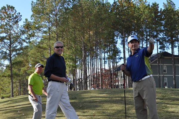 The chapter team lines up the next shot during the Veterans Day Semiannual AFCEA Scholarship Golf Tournament in November.