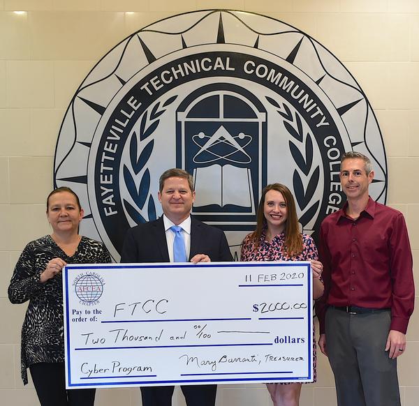 In February, the chapter donated $2,000 to the new cyber academic program at Fayetteville Technical Community College in Fayetteville, North Carolina. Posing in the photo (from l-r) are: Tenette Prevatte, dean, Computer Information Technology Programs, Fayetteville Technical Community College (FTCC); Marv Gordner, chapter vice president, Programs; Lauren Arp, FTCC, and Chris Herring, department chair, Cyber Defense Education Center, FTCC.
