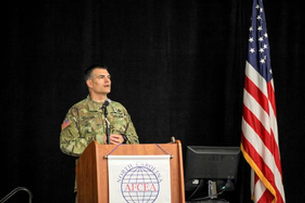 Brig. Gen. David Isaacson, USA, deputy chief of staff, Chief Information Officer (CIO)/G-6 for U.S. Army Forces Command at Fort Bragg, welcomes attendees to the April symposium.