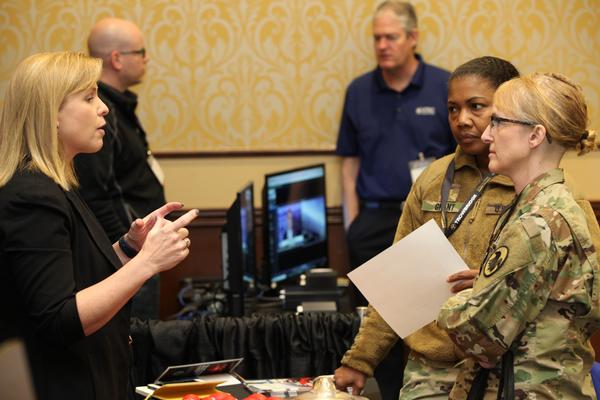 Soldiers from the Fort Bragg Signal community engage industry experts during TechNet Fort Bragg in March at the Iron Mike Conference Center.