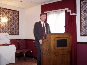 Col. Jerry Stidham, USA (Ret.), director of information management, Fort Bragg, North Carolina, opens the chapter's May meeting.