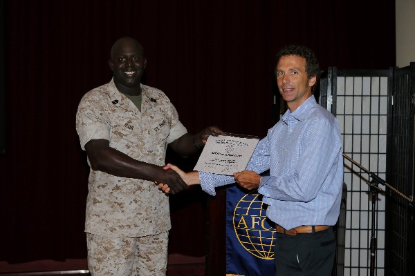 Master Gunnery Sgt. Arthur Allen III, USMC, chapter president (l), presents a certificate of appreciation to Alan 