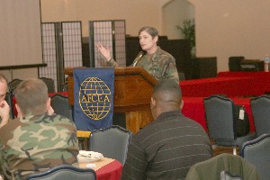Capt. Sandra Buckles, USN, U.S. Forces Japan director of C4 Systems, discusses communications in the military at the April luncheon.