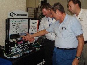 Representatives from American Engineering Corporation and American Computer Services listen to the latest offerings from CommScope at the October event.