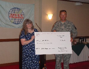 At the February meeting, Col. Elle presents a $1,000 check to Susan Heffner, the winner of the 2008 AFCEA Science Teacher Award. The award will enable Hefner to purchase science materials for her elementary school classes.