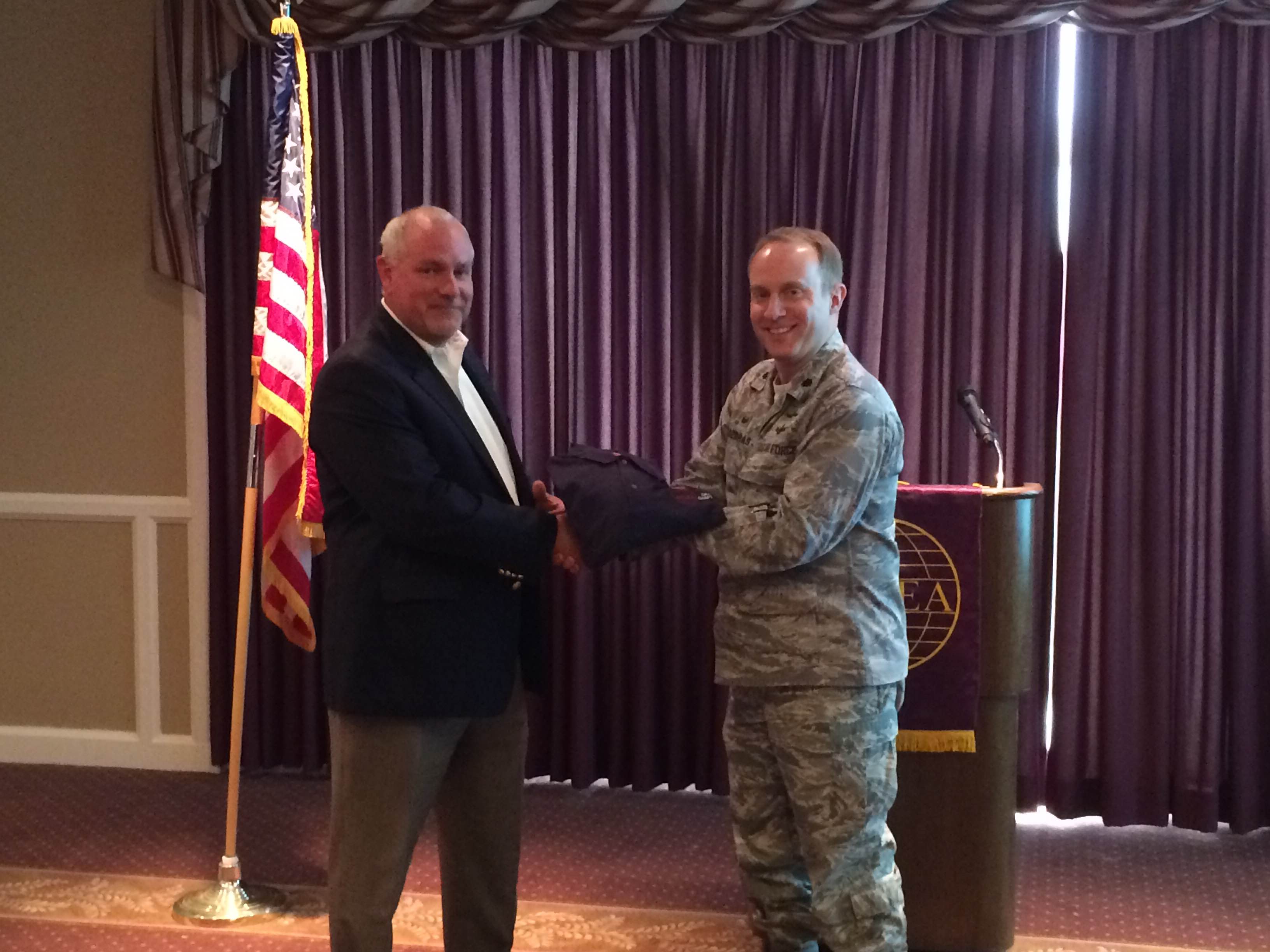 Jeff Ramby of EMC (l) was presented with an AFCEA polo shirt from Lt. Col. Nicholas Kozdras, USAF, chapter president, at the April event.