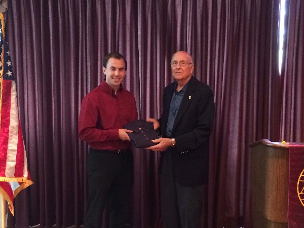 Alexander Orr receives an AFCEA polo shirt after his July presentation to the chapter.
