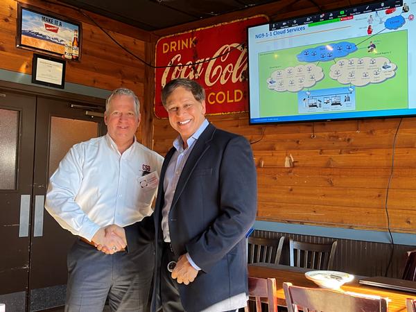 In January, Suresh Gursahaney, CEO, MicroAutomation (r), visits the chapter for its monthly luncheon and discusses Next Generation 9-1-1 technology.