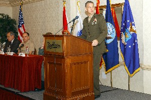 Col. Walt Augustin, USMC, addresses the joint forces of the Central Florida Combined Professional Associations' Group at the annual forum in January.