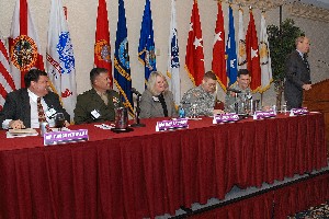 Fred W. Eisele (r), chapter vice president for programs, introduces the C4ISR Support to the Warfighter panel at TechNet Orlando, held in January. From r-l are Maj. Gen. Randy Strong, USA, panel moderator; Maj. Gen. Gregory A. Schumaker, USA; Cindy Morgan; Col. James Turner, USMC; and Chuck Pizzutelli.