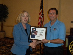 In March, Steve Painter (r), chapter president, presents the chapter's AFCEAN of the Quarter Award to Li McCombs, chapter secretary.