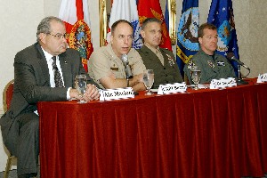 Taking questions at the January forum are speakers (l-r) Peter Marion, Capt. Stephen Burris, USN, Col. Augustin and Col. Lou Olinto, USAF.

