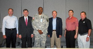 At the July luncheon, the chapter's board of advisers, including (l-r) Col. Jim Ralph, USA (Ret.); Vice Adm. Al Harms, USN (Ret.); Col. Dave Lockhart, USA; Brig. Gen. George Landis, USA (Ret.); Col. Dane Weston, USAF (Ret.); and Jerry Stahl, network after the presentation.
