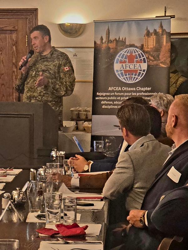 Lt. Col. Tom McMullen, deputy commander of the 7 Communication Group within the Canadian Digital Services Group, speaks to attendees at the September event.