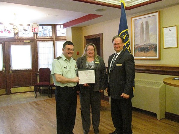 Kelly Stewart-Belisle, Canada regional vice president, and Dave Johnson (r), chapter vice president for communications, present a certificate to the March guest speaker Brig. Gen. R.G. Mazzolin, OMM, CD, Canadian Armed Forces, director of general information management.