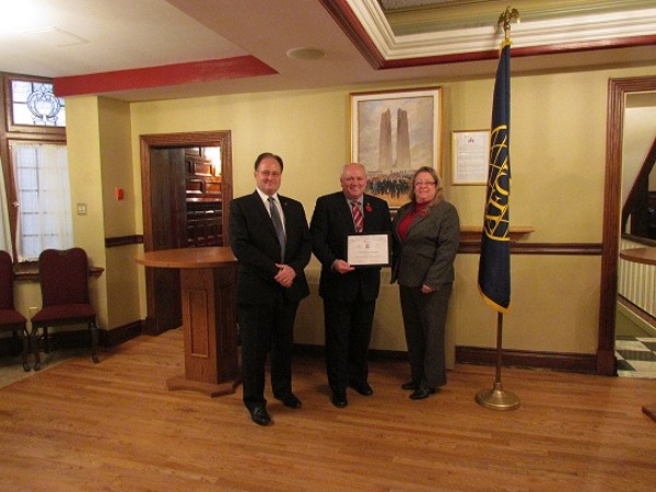 Dave Johnson, chapter vice president for programs, joins with guest speaker Lt. Gen. Charles Bouchard, DND (Ret.), and Kelly Stewart-Belisle, chapter president, at the Remembrance Day event in November.
