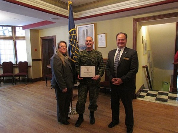 Chapter President Kelly Stewart-Belisle and Vice President of Programs Dave Johnson greet Lt. Col. Donald Mulders of the Department of National Defence after his speech on current challenges for the Canadian Joint Operations Command at the February luncheon.
