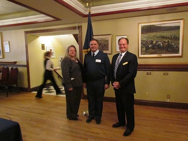 Together at the March meeting are (l-r) Kelly Stewart-Belisle, chapter president; Lt. Col. Nick Torrington-Smith, CAF, guest speaker; and Dave Johnson, chapter vice president of operations.