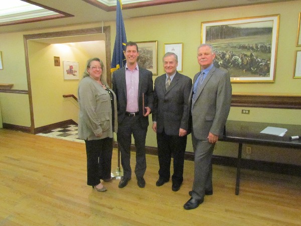 Chapter President Kelly Stewart-Belisle welcomes (from l) guest speaker Peter Hammerschmidt and Calian representatives Jerry Johnston and Michael Cessford at the June luncheon. 

