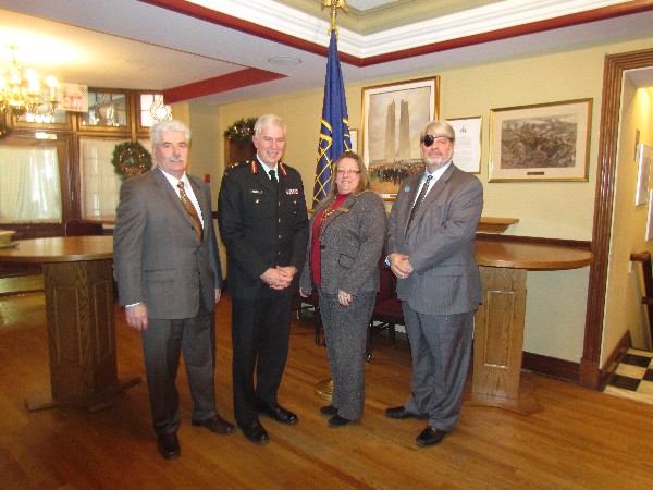 (l-r) Ray Bourret, luncheon sponsor representative from ADGA Group, poses with guest speaker Lt. Gen. Guy R. Thibault, CMM, MSC, CD, Chapter President Kelly Stewart-Belisle and wine sponsor Wayne Teeple from Phirelight Security Solutions at the chapter's Christmas luncheon.
