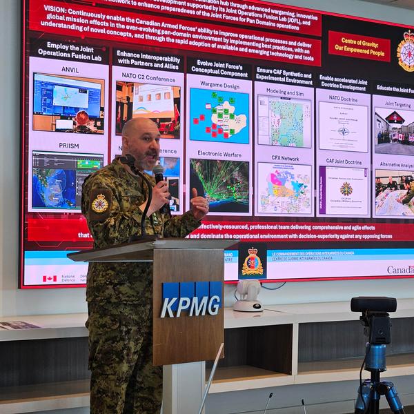 Col. Yannick Michaud, commander, Canadian Joint Warfare Center, presents at the January event.